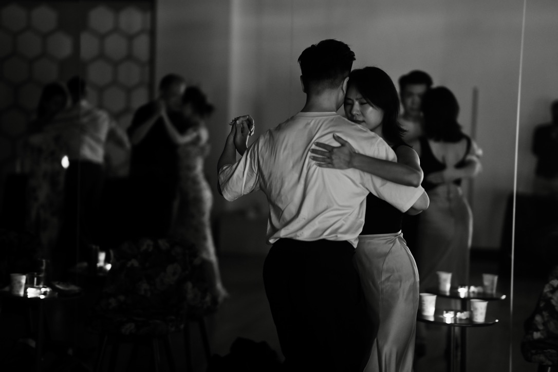 Dancers in close embrace at a TAIFENGO Milonga night